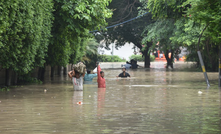 NEW DELHI, INDIA - JULY 13:  People Leave his Home at Raj Niwas Road at Civil Line area after heavy flooded water enter civil line or ring road area  on July 13, 2023 in New Delhi, India.   (Photo by Sonu Mehta/Hindustan)のeditorial素材