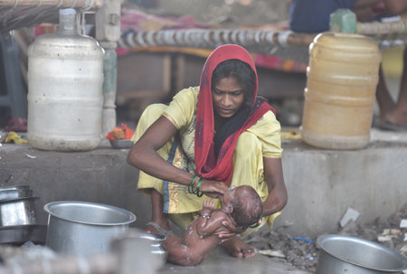 NEW DELHI, INDIA - JULY 30: Yamuna river flood affected people sit-on a relief camp at Mayur Vihar, on July 30, 2023 in New Delhi, India. (Photo by Sonu Mehta/Hindustan Times )のeditorial素材