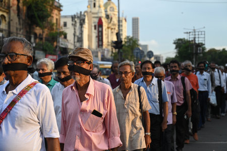 KOLKATA, INDIA - JULY 12:  12th July Committee members put black ribbon on face staged protest rally...