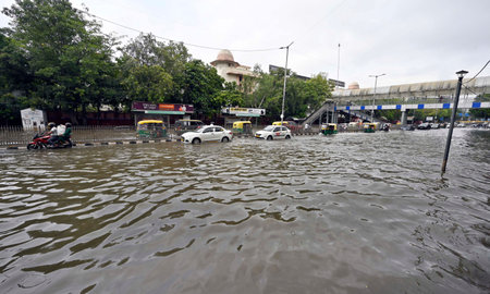 NEW DELHI, INDIA - JULY 16: Commuters move through the floodwaters of the swollen Yamuna river, at ITO, on July 16, 2023 in New Delhi, India. The water level of the river has been rising since Wednesday after it breached an all-time high mark in more thanのeditorial素材