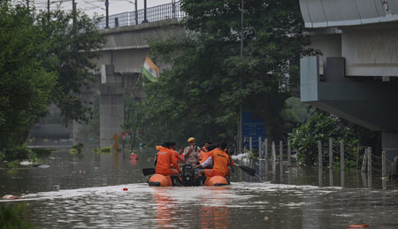 NEW DELHI, INDIA - JULY 13:  NDRF (National Disaster Response Force) personnel rescue people from...
