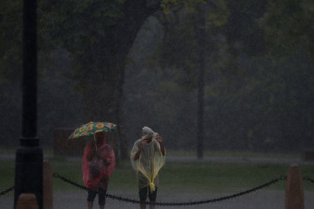 NEW DELHI INDIA JULY 9 2023 People enjoying under heavy rainfall at India Gate Kartavya Path on July 9 2023 in New Delhi India Delhi NCR was drenched with heavy rain on the intervening night of Friday Saturday and Sunday The overnight shower which continuのeditorial素材