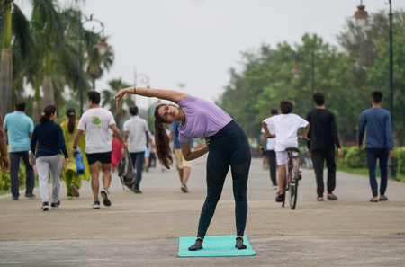 LUCKNOW INDIA JUNE 21 2023 A women poses a from of yoga on the occasion of International Yoga Day at Janeshwar Mishra Park on June 21 2023 in Lucknow India Photo by Deepak Gupta Hindustan Timesのeditorial素材