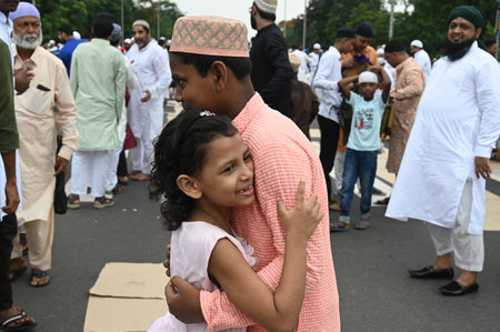 KOLKATA INDIA JUNE 29 2023 Young Muslim devotees after offering prayers on the occasion of Eid ul Adha also known as Feast of Sacrifice or Bakra Eid at Red Road on June 29 2023 in Kolkata India Eid ul Adha also known as Bakra Eid Bakrid Eid al Adha Eid Quのeditorial素材