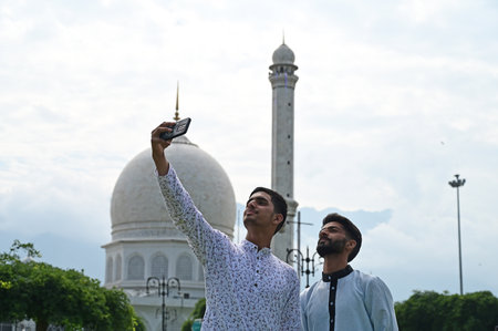 SRINAGAR INDIA JUNE 29 2023 Muslim devotees offer prayers on the occasion of Eid al Adha at Hazratbal shrine on June 29 2023 in Srinagar India Eid ul Adha also known as Bakra Eid Bakrid Eid al Adha Eid Qurban or Qurban Bayarami is Islamic festivals celebrのeditorial素材