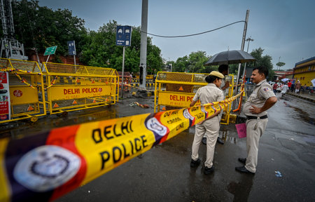 NEW DELHI INDIA JUNE 25 2023 A view of Delhi police barricades the spot where a woman died of electrocution at New Delhi Railway Station after she touched an electric pole at a waterlogged area on June 25 2023 in New Delhi India A 34 year old woman today のeditorial素材