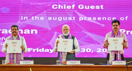 NEW DELHI INDIA JUNE 30 2023 Prime Minister Narendra Modi with Union Minister for Education Dharmendra Pradhan and Vice Chancellor of the University of Delhi Yogesh Singh during the releases a coffee table book at the valedictory ceremony of the centenaryのeditorial素材