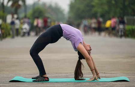 LUCKNOW INDIA JUNE 21 2023 A women poses a from of yoga on the occasion of International Yoga Day at Janeshwar Mishra Park on June 21 2023 in Lucknow India Photo by Deepak Gupta Hindustan Timesのeditorial素材