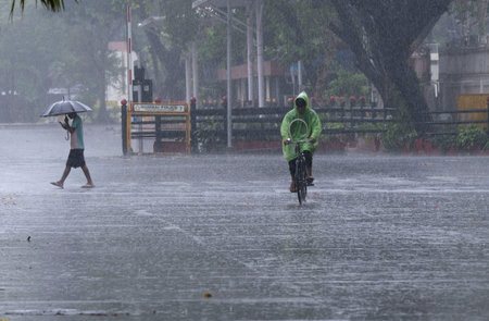 MUMBAI INDIA JUNE 25 2023 People dealing with rain at Nariman Point on June 25 2023 in Mumbai India...