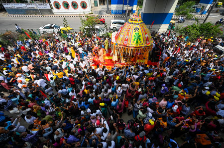 NEW DELHI INDIA JUNE 20 2023 Devotees take part in the annual Jagannath Rath Yatra the festival of chariots at Hauz Khas on June 20 2023 in New Delhi India The Jagannath Puri Rath Yatra is an annual festival celebrated in the city of Puri Odisha The festiのeditorial素材
