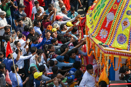 NEW DELHI INDIA JUNE 20 2023 Devotees take part in the annual Jagannath Rath Yatra the festival of chariots at Hauz Khas on June 20 2023 in New Delhi India The Jagannath Puri Rath Yatra is an annual festival celebrated in the city of Puri Odisha The festiのeditorial素材