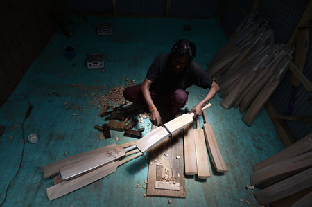 SRINAGAR INDIA JUNE 12 2023 A laborer works in a GR8 cricket bat manufacturing unit in Sangam some...