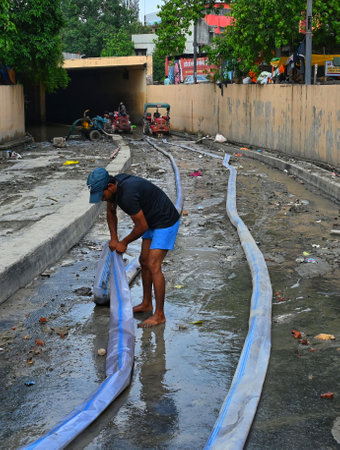 NEW DELHI INDIA JULY 19 2023 Cleaning and drain out the slush and flood water in under progress in the area near Yamuna Bazar a Nigam Bodh Ghat on July 19 2023 in New Delhi India Daily life started limping back to normalcy in the national capital as the wのeditorial素材