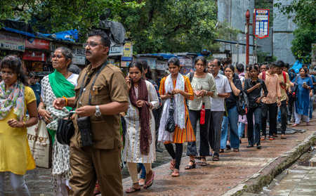 MUMBAI, INDIA - AUGUST 3: Crowd of commuters standing in a queue waiting for the bus during the...