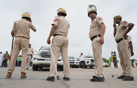 GURUGRAM, INDIA - AUGUST 8: Haryana police personnel deployed at Sohna-Nuh road near Rojka Meo wake of communal violence on August 8, 2023 in Gurugram, India. The attack on the procession last Monday had triggered communal clashes in Nuh, which quickly spのeditorial素材