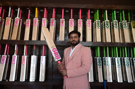 SRINAGAR INDIA JUNE 12 2023 Fawzul Kabir the owner of a GR8 cricket bat manufacturing unit displays a bat on June 12 2023 in Srinagar India GR8 bat manufacturers have received an order for bats to be used during the 2023 One Day International ODI World Cuのeditorial素材