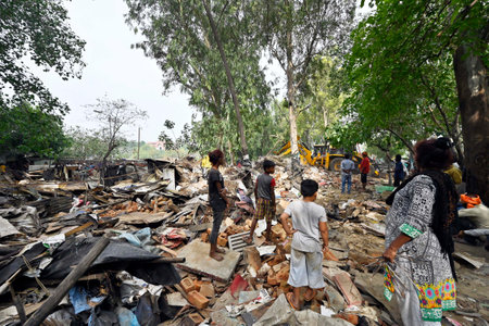NEW DELHI INDIA JUNE 1 2023 A bulldozer being used to demolish illegal structures during an anti encroachment drive at Bhairon Marg near Pragati Maidan on June 1 2023 in New Delhi India The government s public works department PWD on Thursday morning starのeditorial素材