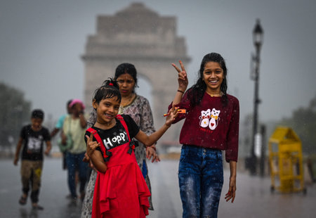 NEW DELHI INDIA JUNE 19 2023 Commuters out in the rain at Kartavya path on June 19 2023 in New Delhi India The city received 5mm of rainfall during the 24 hour period which ended at 8 30am on Monday The minimum temperature settled at 25 5 degrees Celsius のeditorial素材