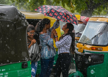 NEW DELHI INDIA JUNE 19 2023 Commuters out in the rain at Kartavya path on June 19 2023 in New Delhi India The city received 5mm of rainfall during the 24 hour period which ended at 8 30am on Monday The minimum temperature settled at 25 5 degrees Celsius のeditorial素材