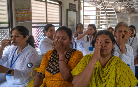 MUMBAI INDIA JUNE 21 2023 Commuters take part in a yoga session inside a local train to mark the International Day of Yoga on June 21 2023 in Mumbai India Photo by Satish Bate Hindustan Timesのeditorial素材