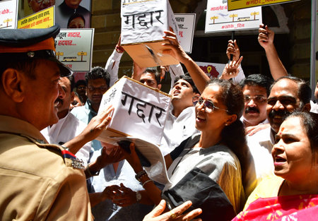 MUMBAI INDIA JUNE 20 2023 NCP party leader Supriya Sule along with party workers stage a protest against Eknath Shinde faction Shiv Sena quits MVA government completion of one year NCP workers called today as a Gaddar Din Traitor Day to protest for the coのeditorial素材