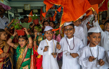 MUMBAI INDIA JUNE 28 2023 Girls dressed in traditional sarees and boys as warkaris pilgrims students of Sarsavati school Mahim participate in a Bal Dindi Yatra procession on the eve of Ashadhi Ekadashi on June 28 2023 in Mumbai India Photo by Satish Bate のeditorial素材