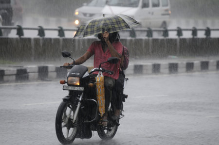 GURUGRAM INDIA JUNE 29 2023 Commuters are seen at National Highway 48 amid heavy rain showers near Star Mall sector 31 on June 29 2023 in Gurugram India Photo by Parveen Kumar Hindustan Timesのeditorial素材