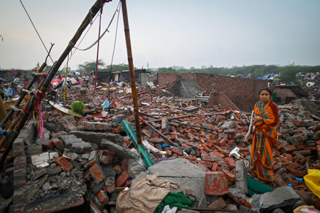 NEW DELHI INDIA MAY 1 2023 Locals seen taking out their valuables from the demolished structures as ASI along with the district administration carries out demolishing drive of illegal constructions near Tughlaqabad Fort on May 1 2023 in New Delhi India Phのeditorial素材