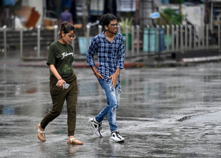 NOIDA INDIA MAY 3 2023 Commuters out in the light rain on the Sector 18 Road on May 3 2023 in Noida India Photo by Sunil Ghosh Hindustan Timesのeditorial素材