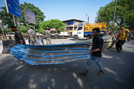 NEW DELHI INDIA MAY 13 2023 People seen taking out their valuables as MCD officials along with district administration demolishes the illegal structures at Dhaula Kuan on May 13 2023 in New Delhi India Photo by Sanchit Khanna Hindustan Timesのeditorial素材