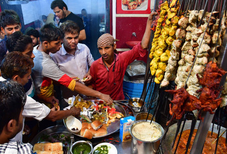 MUMBAI INDIA APRIL 4 2023 Vendors cook and sell various delicious food delicacies on the roadside stalls in holy month of Ramadan near Minara Masjid at Pydhonie on April 4 2023 in Mumbai India Photo by Bhushan Koyande Hindustan Timesのeditorial素材