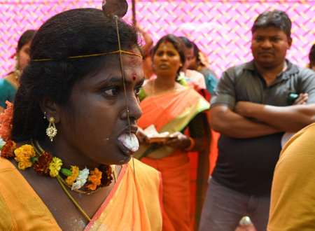 NEW DELHI INDIA APRIL 5 2023 A devotee with his body pierced with metal skewers takes part in a religious procession to mark the Panguni Uthiram festival on April 5 2023 in New Delhi India Photo by Vipin Kumar Hindustan Timesのeditorial素材