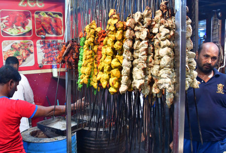 MUMBAI INDIA APRIL 4 2023 Vendors cook and sell various delicious food delicacies on the roadside stalls in holy month of Ramadan near Minara Masjid at Pydhonie on April 4 2023 in Mumbai India Photo by Bhushan Koyande Hindustan Timesのeditorial素材
