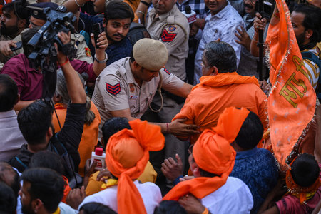 NEW DELHI INDIA APRIL 6 2023 Devotees takes part in a procession during Hanuman Jayanti celebrations...