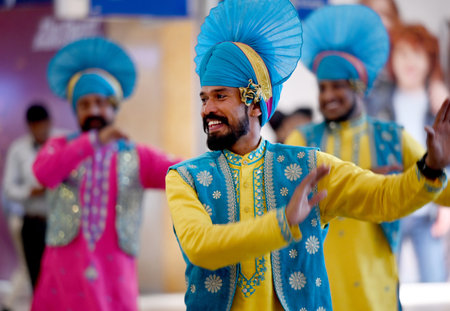 NOIDA INDIA APRIL 13 2023 Folk dancers from Punjab perform during the program organized on the occasion Vaisakhi at GIP mall at sector 38A on April 13 2023 in Noida India Photo by Sunil Ghosh Hindustan Timesのeditorial素材