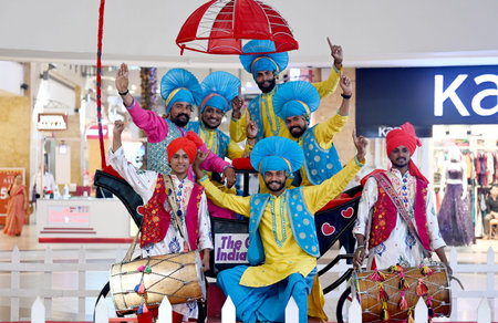 NOIDA INDIA APRIL 13 2023 Folk dancers from Punjab perform during the program organized on the occasion Vaisakhi at GIP mall at sector 38A on April 13 2023 in Noida India Photo by Sunil Ghosh Hindustan Timesのeditorial素材