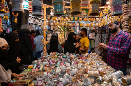 MUMBAI INDIA APRIL 20 2023 Muslim women select and wear colourful bangles from a stall as part of their upcoming Muslim Eid al Fitr festival shopping at Modh Ali Rd on April 20 2023 in Mumbai India Photo by Anshuman Poyrekar Hindustan Timesのeditorial素材