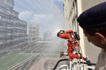 NEW DELHI INDIA APRIL 20 2023 Firefighters showing their skills during a fire mock drill at HT House KG Marg on April 20 2023 in New Delhi India Photo by Sonu Mehta Hindustan Timesのeditorial素材