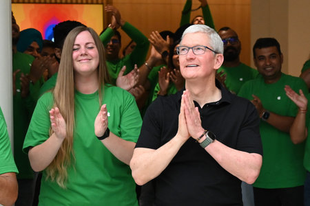 NEW DELHI INDIA APRIL 20 2023 Apple CEO Tim Cook greets the customers at the opening of India s...