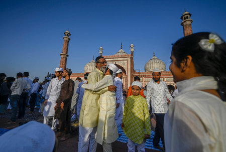 NEW DELHI INDIA APRIL 22 2023 Muslims greet each other after offering Eid Ul Fitr prayers at the Jama Masjid on April 22 2023 in New Delhi India Muslims around the world are getting into the festive Eid spirit as the holy month of Ramadan concludes The feのeditorial素材