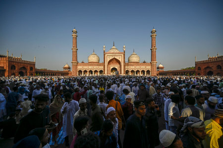 NEW DELHI INDIA APRIL 22 2023 Muslims greet each other after offering Eid Ul Fitr prayers at the Jama Masjid on April 22 2023 in New Delhi India Muslims around the world are getting into the festive Eid spirit as the holy month of Ramadan concludes The feのeditorial素材