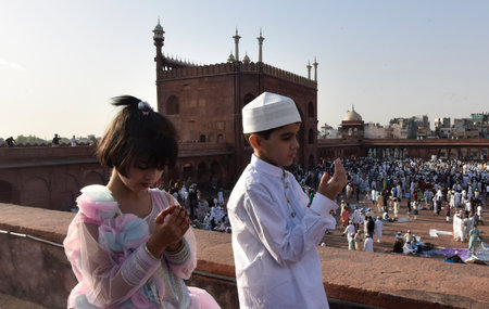 NEW DELHI INDIA APRIL 22 2023 Muslims Children offer prayers at the Jama Masjid on the occasion of Eid ul Fitr at Jama Masjid in Old Delhi on April 22 2023 in New Delhi India Muslims around the world are getting into the festive Eid spirit as the holy monのeditorial素材