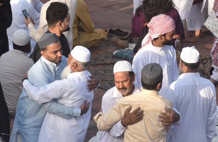 NEW DELHI INDIA APRIL 22 2023 Muslims greets after offer prayers at the Jama Masjid on the occasion of Eid ul Fitr in Old Delhi on April 22 2023 in New Delhi India Muslims around the world are getting into the festive Eid spirit as the holy month of Ramadのeditorial素材
