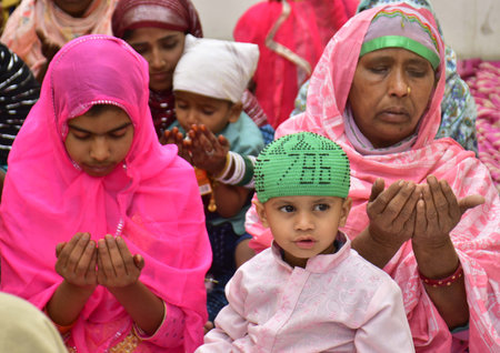 AMRITSAR INDIA APRIL 22 2023 Muslim Devotees offer prayers on the occasion of the Eid Ul Fitr at Khairuddin Mosque on April 22 2023 in Amritsar India Muslims around the world are getting into the festive Eid spirit as the holy month of Ramadan concludes Tのeditorial素材