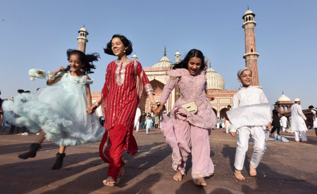 NEW DELHI INDIA APRIL 22 2023 Children enjoying after offering prayers on the occasion of Eid ul Fitr at Jama Masjid in Old Delhi on April 22 2023 in New Delhi India Muslims around the world are getting into the festive Eid spirit as the holy month of Ramのeditorial素材