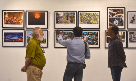 NEW DELHI INDIA APRIL 23 2023 People visit a Big Picture Exhibition 2023 organized by Working News Cameraman Association on April 23 2023 in New Delhi India The All India Working News Cameramenâs Association is bringing together the best photojournalistのeditorial素材
