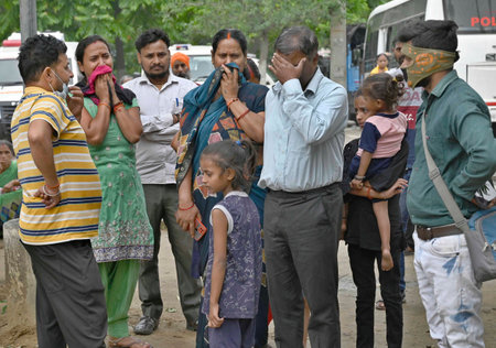 LUDHIANA INDIA APRIL 30 2023 Aggrieved family members of the deceased of gas leak incident at Civil Hospital on April 30 2023 in Ludhiana India Eleven people including two children are feared dead and many others are feared trapped inside a factory on Suaのeditorial素材