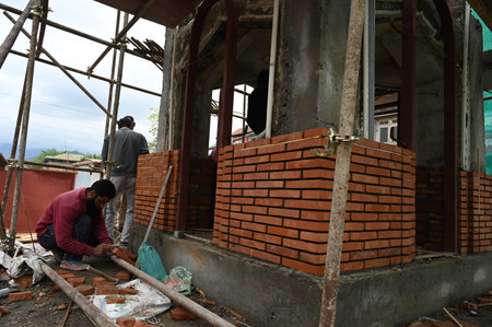 SRINAGAR INDIA APRIL 27 2023 Labourers carry renovation works on Ghanta Ghar Clock Tower in the City Centre Lal Chowk on April 27 2023 in Srinagar India Ahead of G20 meeting scheduled next month the Srinagar city is getting renovated under the Srinagar Smのeditorial素材