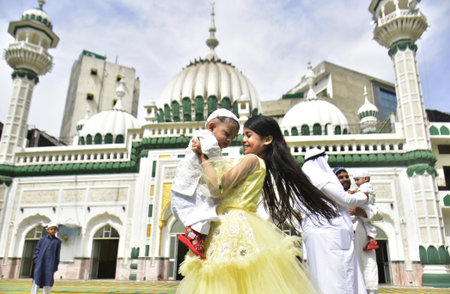 AMRITSAR INDIA APRIL 22 2023 A muslim girl play with her brother after offering prayers on the occasion of the Eid Ul Fitr at Khairuddin Mosque on April 22 2023 in Amritsar India Muslims around the world are getting into the festive Eid spirit as the holyのeditorial素材
