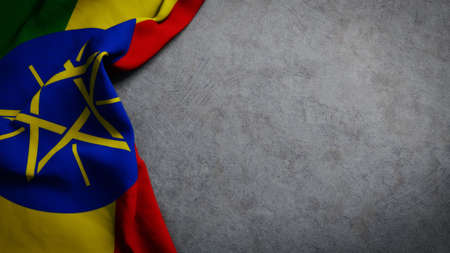Flag of Ethiopia on concrete backdrop. Ethiopian flag background with copy spaceの写真素材
